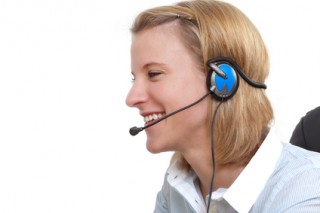 Beautiful customer service operator woman with headset